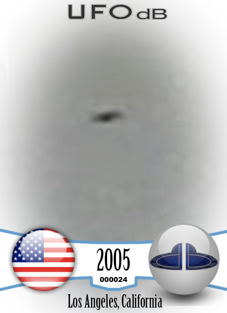 UFO picture taken in 2005 showing ufo close to coming airplane UFO CARD Number 24